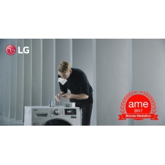 Bryan Berg building a 3.3-meter-tall house of cards on top of an LG Centum System™ washing machine