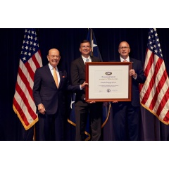 James K. Hawley, Director of International Business Development (right), and Philip Lesniak, Import/Export Manager (center), of Automated Packaging Systems, receive the President’s “E” Award for Exports from Wilbur Ross, Secretary of Commerce (left).