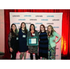 Dawn Abbott, center, owner of Fun Productions, Inc. surrounded by members of her talented staff