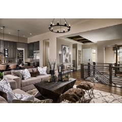 Shot of Berkeley Homes� Residence One model home at the Timbers at the Pinery community. These plans feature open living concepts with high vaulted ceilings and connected rooms.
