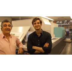 Haig Atamian, CEO, left, with his son Garo, senior vice president, and the J Press 720S by Fujifilm, at their Las Vegas facility.