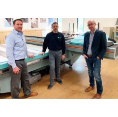 Pictured, left to right, Craig Inglish, Brad Flagge, and Nick Bova alongside the Acuity F by Fujifilm.