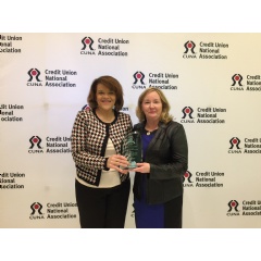 CommonWealth One’s President and CEO Charlotte Cash (right) and Chief Marketing Officer Karyle Thornton accept CUNA’s first place award.