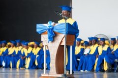 Loubenson Saint-Jean gives the commencement speech during Habitat Haiti’s training graduation ceremony.