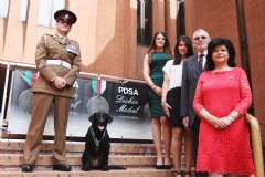 Sergeant Major Andy Dodds and Fire with members of the late Lance Corporal Kenneth Rowe�s family