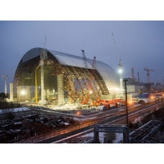 The New Safe Confinement arch was assembled in sections near the damaged reactor and slid into place on rails. Photo: European Bank for Reconstruction and Development