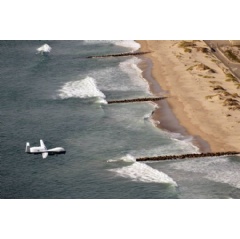The first operational MQ-4C Triton comes in for a landing at Naval Base Ventura County, Point Mugu, on November 9. (Photo credit: U.S. Navy)