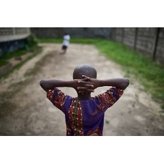 Boys play football at the HAPPY KIDS and Adolescent NGO in Kenema, Sierra Leone, Sunday 4 June 2017. HAPPY Kids and Adolescents is supported by UNICEF to provide services to children living with HIV and AIDS or those affected by it. 
© UNICEF/Phelps
