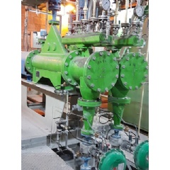 Volumetric dosing device for precise feeding of Mg with rates between 3 and 15 kg/min