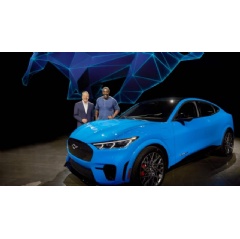Ford Motor Company Executive Chairman Bill Ford, left, and actor Idris Elba next to Ford Motor Co.’s all-electric Mustang Mach-E GT SUV at Jet Center Los Angeles in Hawthorne, California.