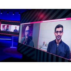 CEOs chatting via video: Tim H�ttges and Sundar Pichai discussing the latest news about the partnership between Deutsche Telekom and Google.