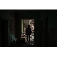 UNICEF/UN0726020/Ibarra Sánchez. On 27 September 2022 in Chernihiv, Ukraine, Darya Nikolayenko, 14, walks through rubble in School #21, which was destroyed by bombing on 3 March.