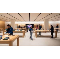 Customers enter Apple Saket though a uniquely designed curved storefront with white oak tables displaying Apple�s products and accessories.