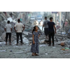 UNICEF/UNI448902/Mohammad Ajjour
Amal, 7 years old, contemplates her neighbourhood after neighbouring homes were levelled to the ground. No words can describe the devastation she sees.