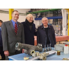 Derco President and General Manager Todd Morar, Deputy Secretary General of NATO Mircea Geoană and Aerostar President and CEO Grigore Filip (left to right) visit an aircraft landing gear production line at Aerostar in Bacau, Romania.