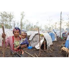 Mutuhimana Godence, 38, and her baby Alliance in a camp for internally displaced people in Rusayo, North Kivu province, DR Congo.
© UNHCR/Blaise Sanyila