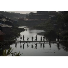 UNICEF/2018/Nybo
FILE PHOTO: A group of Rohingya refugee children gather at sunset on a bamboo bridge in Kutupalong makeshift settlement, Coxs Bazar District, Bangladesh, Thursday 11 January 2018.