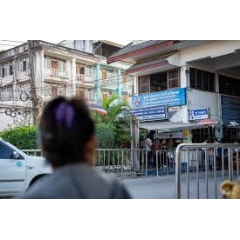 WHO / Ploy Phutpheng
People queue and present documents at the Tak Immigration Checkpoint for outbound border processing.