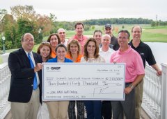 Ken Lane, President of BASF’s Catalysts Division (right, front row) and Phil Salerno, President of the Children’s Specialized Hospital Foundation (left, front row) are joined by members of the BASF golf tournament planning committee.