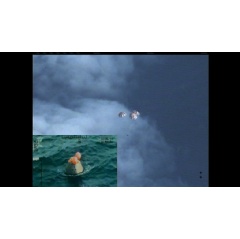 Following a perfect launch and more than 4 hours in Earths orbit, NASAs Orion spacecraft is seen from an unpiloted aircraft descending under 3 massive red and white main parachutes... Image Credit: NASA