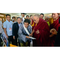 His Holiness the Dalai Lama launching the Meditation & Science Center�s new website at Drepung Loseling Monastery, Mundgod, Karnataka, India. Photo by Lobsang Tsering