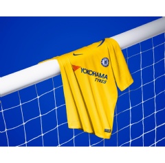 The yellow jersey and shorts are complemented by a pair of rush blue socks which feature a yellow band across the shin.