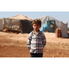 �  UNICEF/UN0233870/Al Shami

In rural Idlib, Syrian Arab Republic, an internally displaced boy stands near his temporary shelter.