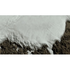 Two views of the Hiawatha crater region: one covered by the Greenland Ice Sheet, the other showing the topography of the rock beneath the ice sheet, including the crater.
Credits: NASA/Cindy Starr