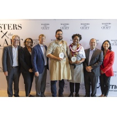 Culinary winner Kandice Symister and Beverage winner Mitchell Patmagrian celebrate with Marriott International executives