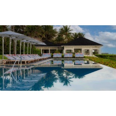 The infinite-edge Ocean Pool at The Ocean Club is adorned with the new Four Seasons + Jacquemus collboration