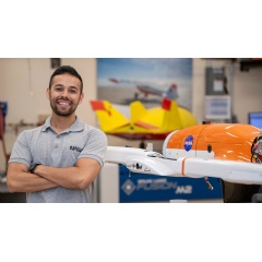 Felipe Valdez, a NASA engineer at Armstrong Flight Research Center’s Dale Reed Subscale Flight Research Laboratory, stands next to a subscale model of the Hybrid Quadrotor (HQ-90) aircraft.
NASA / Charles Genaro Vavuris