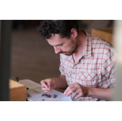Researcher Fred Horne examining fossils from a northern Kenyan site called Napudet, which was part of the study.