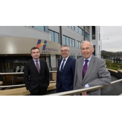 From left to right: Geoffrey Agnew MBE, Martin Agnew MBE, and their father John Agnew CBE