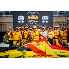 Winner #10: Alex Palou, Chip Ganassi Racing Honda celebrates with his team, World Cup Trophy, and the flag of World Cup winners Spain in Victory Lane