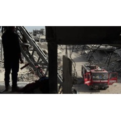 Palestinian recovery crews work to recover bodies buried under the rubble of the Abu Naser family’s apartment building, destroyed in an Israeli strike in October 2024 in northern Gaza.
Anas Baba/NPR