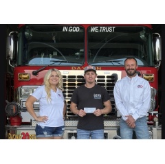 Brandan and Kyleigh Reesman are pictured here with Austin Brocious (center), Fire Chief of Dayton District Volunteer Fire Department, delivering the funds raised.