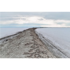 The Salduro Loop dike at the Bonneville Salt Flats separates private land from the federal land where racing and other recreational activities occur. (See complete caption below)