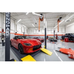 SEMA President & CEO Mike Spagnola, left, and SEMA Garage Detroit General Manager Ben Kaminsky cut the ribbon on the new 45,000-square-foot SEMA Garage in Detroit. (See complete caption below)