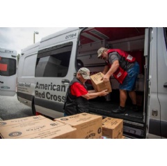 American Red Cross volunteers Charles Clegg and Laymond Conrado load feeding supplies in Tallahassee to deliver to shelters across northern Florida after Hurricane Debby. Photo by Jason Colston/American Red Cross