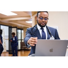 Apple’s ecosystem of products — including Mac, iPhone, iPad, and Apple Watch — has been deployed throughout Emory’s 100-bed Hillandale Hospital among care teams and clinicians like Dr. Yoseph Tekleyes.
