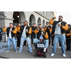 Adam Devine with NFL stars Bijan Robinson, George Kittle, and Jordan Mailata, plus professional vocal group, Fundamentally Sound