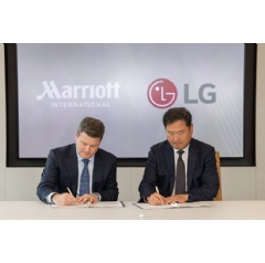 Drew Pinto, EVP and Chief Revenue and Technology Officer Marriott International and Don Kwack, President and CEO LG Electronics North America sign strategic agreement at Marriott International HQ
