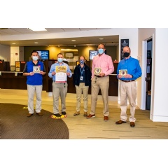Pictured from left to right: Raul DeCecco, Branch Manager; Chris Olinick, Chief Experience Officer; Amanda Gamble from the Alexandria Health Department; Frank Wasson, President/CEO, David Lane, Director of Human Resources.